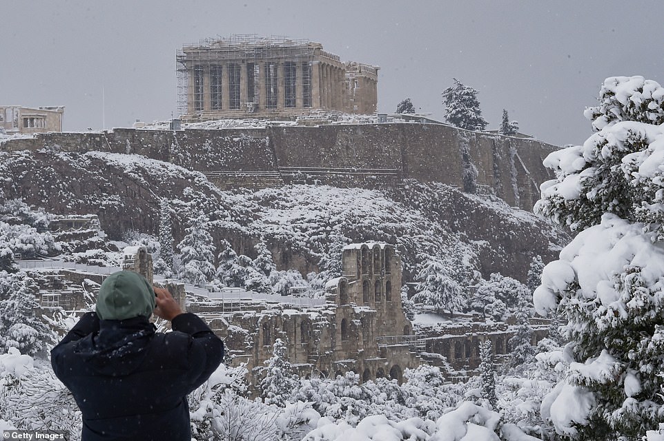 Acropolis covered in snow in photos as cold weather hits Athens